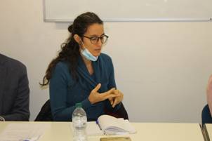 A person sitting at a table

Description automatically generated with medium confidence