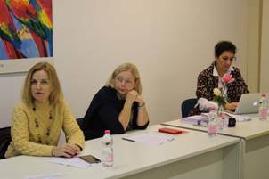 A group of women sitting at a table

Description automatically generated with medium confidence